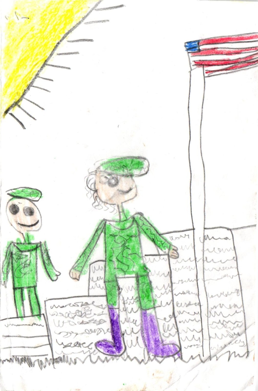 A colored-pencil drawing on white paper. Two soldiers in green camouflage uniforms with green caps stand on a strip of scribbled grass. On the left, a smaller soldier stands between two gravestones with wavy scribble lines suggesting handwritten inscriptions. On the right, a taller soldier in matching green uniform and purple boots stands next to a tall vertical flagpole. At the top of the pole, a red-and-white American flag with a blue corner canton flies to the right. A bright yellow sun with rays radiates from the upper-left corner of the page.